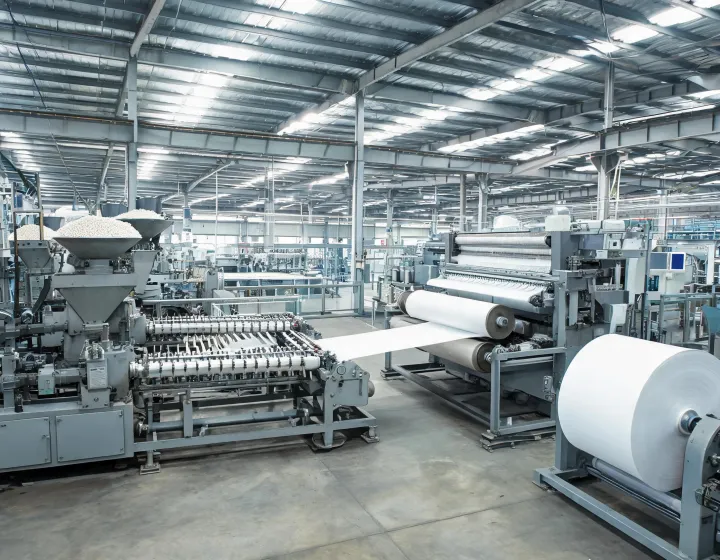 Spunbond beam and bonding calender on a nonwoven fabric production floor